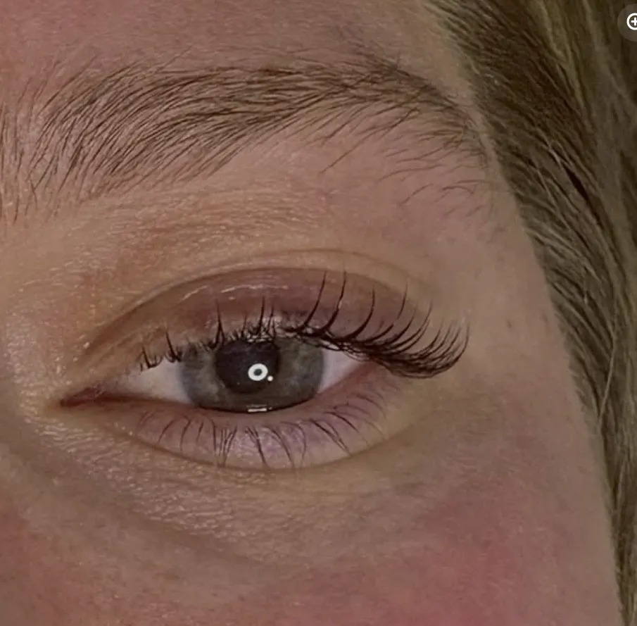 Lifted and tinted lashes under a groomed brow
