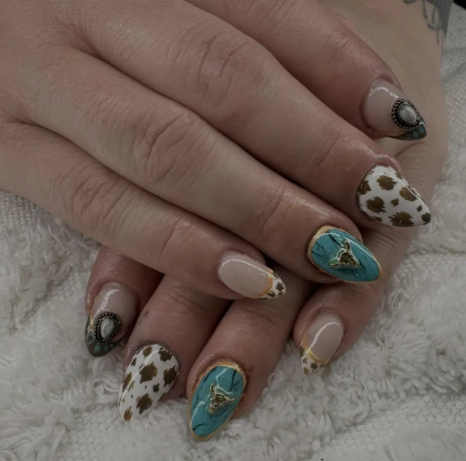 Turquoise, cow print and western charm nails