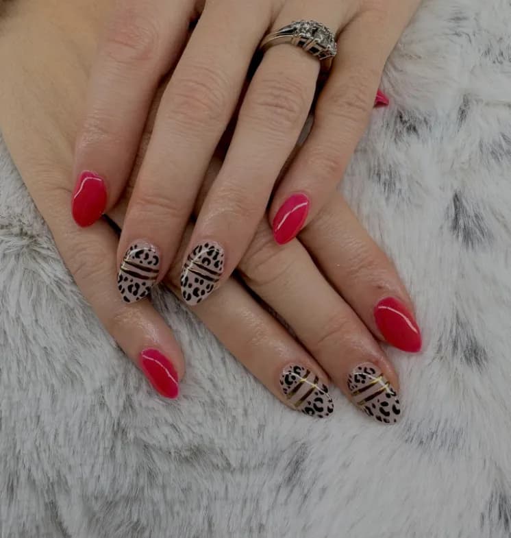 Red almond nails with leopard print accents