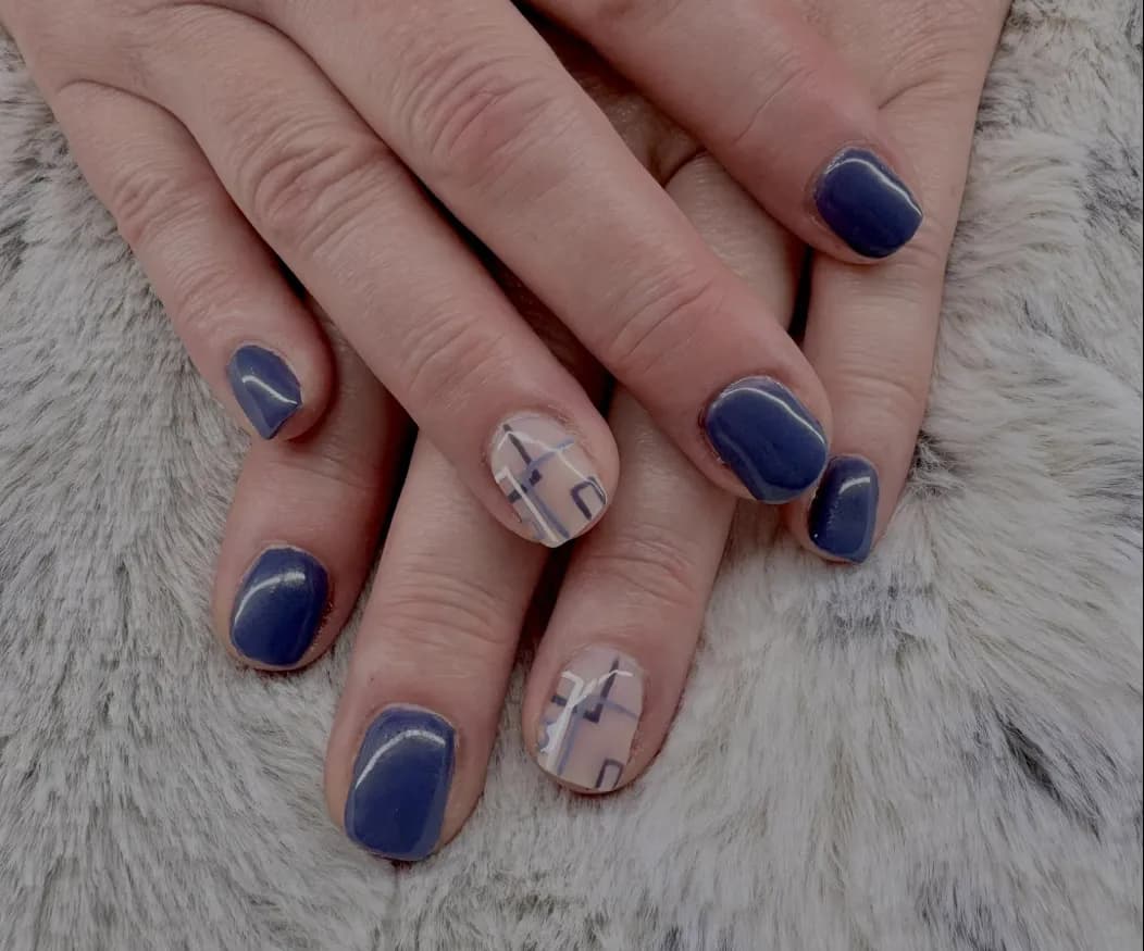 Navy nails with plaid accent nails